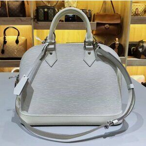 Slightly Used Louis Vuitton Alma EPI Leather Handbags With a Shoulder Belt